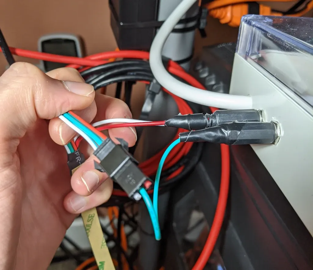 Close up of wiring from LED strip, using DC plugs to interface with the project box.